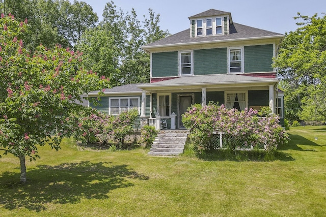 115 Babbidge Rd, Islesboro, ME 04848 - view of front of property with a porch, a front yard, and a shingled roof