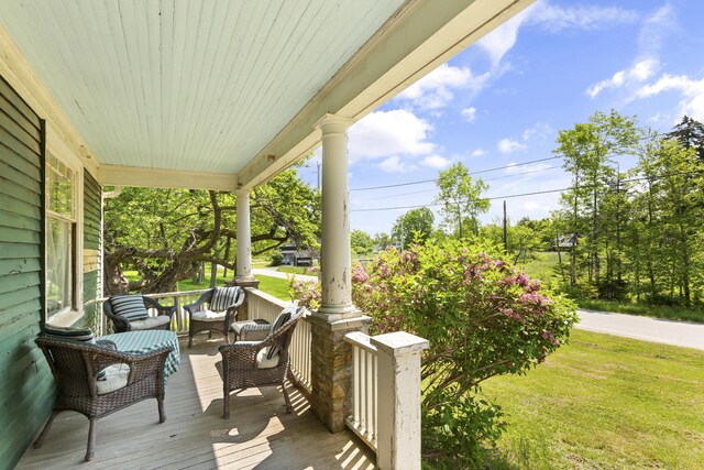 115 Babbidge Rd, Islesboro, ME 04848 - wooden porch with a yard