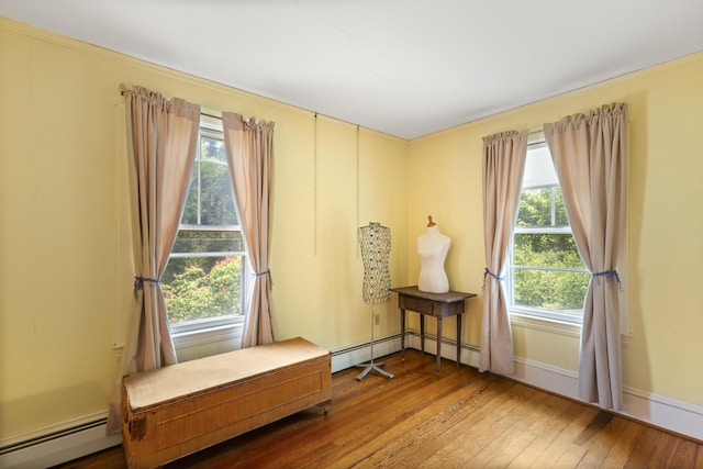 115 Babbidge Rd, Islesboro, ME 04848 - living area featuring a baseboard heating unit and hardwood / wood-style flooring