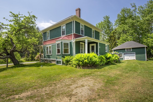 115 Babbidge Rd, Islesboro, ME 04848 - rear view of property with a chimney, a garage, a yard, and an outdoor structure