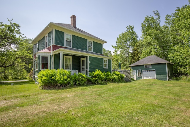115 Babbidge Rd, Islesboro, ME 04848 - rear view of property featuring a chimney, a detached garage, a yard, and covered porch