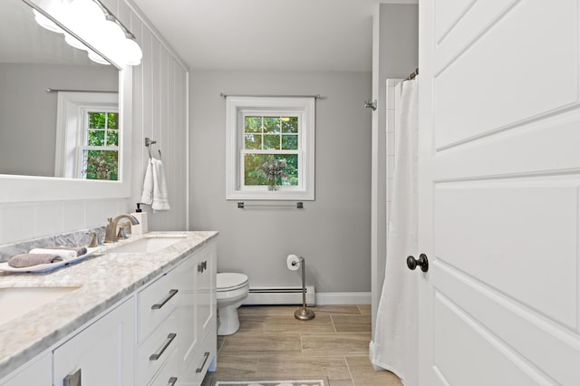 3 Ethan Way, Gray, ME 04039 - full bathroom featuring a baseboard heating unit, healthy amount of natural light, and double vanity
