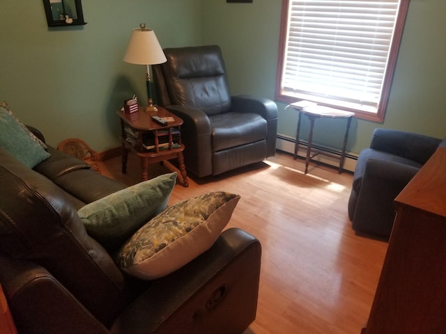 14 Reach Rd, Presque Isle, ME 04769 - living room featuring baseboard heating and light wood-style flooring