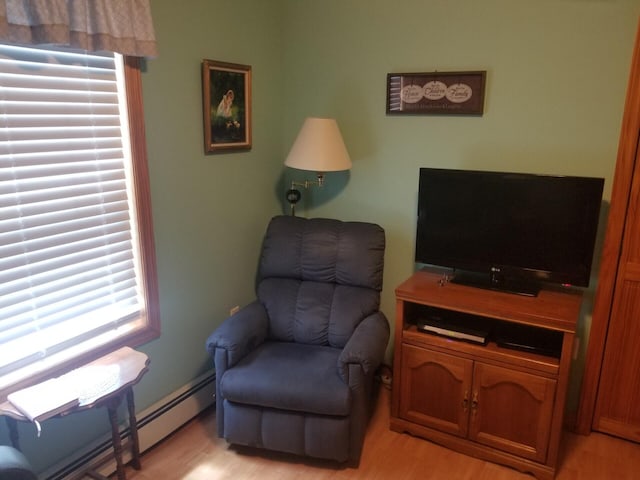 14 Reach Rd, Presque Isle, ME 04769 - living area with baseboard heating and light wood-style flooring