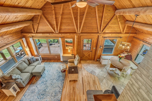 221 Gates Rd, Jefferson, ME 04348 - living room featuring a wooden ceiling with exposed beams, hardwood / wood-style floors, ceiling fan, and high vaulted ceiling