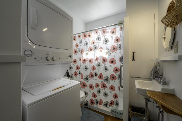 878 State Route 32, Bristol, ME 04564 - laundry area with stacked washer and clothes dryer and wood finished floors