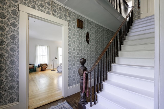 878 State Route 32, Bristol, ME 04564 - staircase featuring wallpapered walls, wood finished floors, and ornamental molding