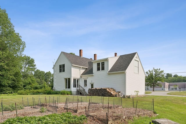 428 Webbs Mills Rd, Raymond, ME 04071 - back of house with a garden, a shingled roof, and a chimney