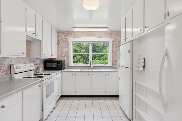 428 Webbs Mills Rd, Raymond, ME 04071 - kitchen with white appliances, light tile patterned flooring, white cabinetry, and light countertops