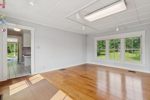 428 Webbs Mills Rd, Raymond, ME 04071 - unfurnished room with rail lighting and wood finished floors