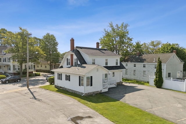 930 Forest Ave, Portland, ME 04103 - view of property exterior featuring a chimney and roof with shingles