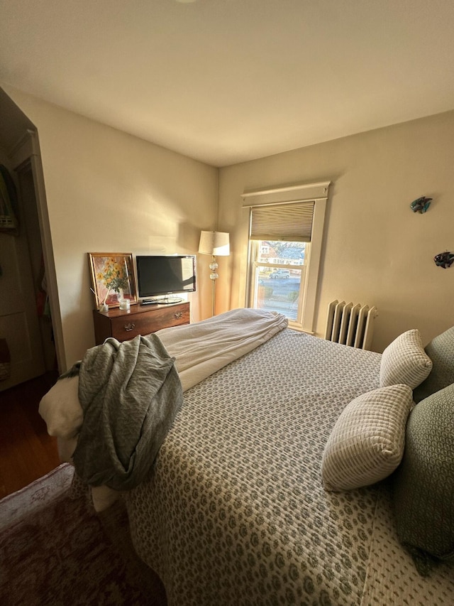 930 Forest Ave, Portland, ME 04103 - bedroom with radiator heating unit and wood finished floors