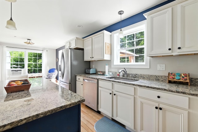 50 Carlisle Ln, Wells, ME 04090 - kitchen with appliances with stainless steel finishes, light wood-type flooring, plenty of natural light, and cooling unit