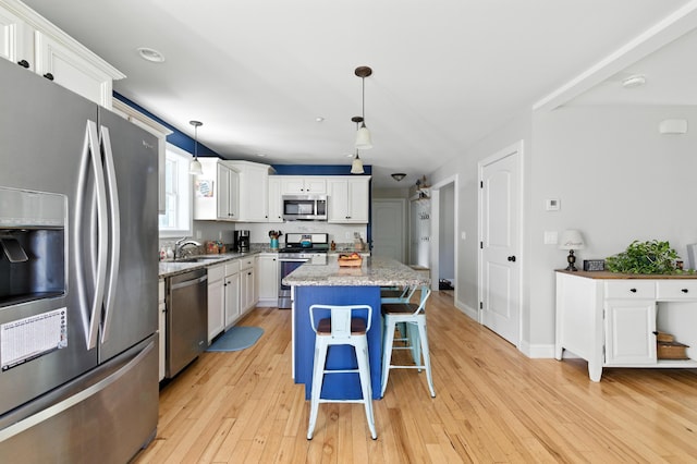 50 Carlisle Ln, Wells, ME 04090 - kitchen featuring appliances with stainless steel finishes, light wood finished floors, white cabinetry, and recessed lighting