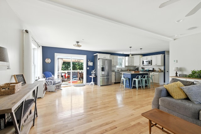 50 Carlisle Ln, Wells, ME 04090 - living area featuring light wood-type flooring and a ceiling fan
