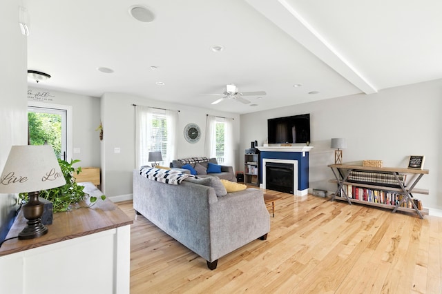 50 Carlisle Ln, Wells, ME 04090 - living room featuring light wood-style flooring, healthy amount of natural light, a glass covered fireplace, a ceiling fan, and recessed lighting