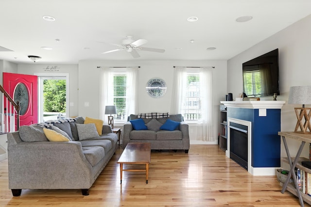 50 Carlisle Ln, Wells, ME 04090 - living room featuring light wood-style flooring, healthy amount of natural light, a ceiling fan, recessed lighting, and a fireplace