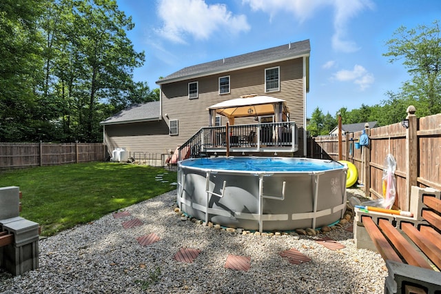 50 Carlisle Ln, Wells, ME 04090 - back of house featuring a gazebo, a fenced backyard, a wooden deck, and a shingled roof
