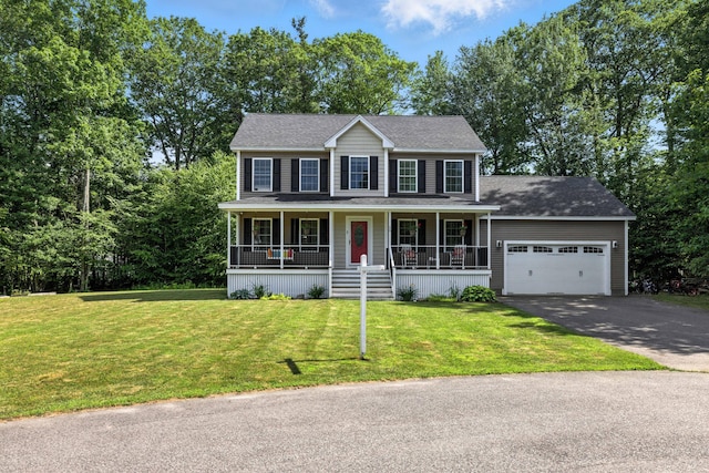 50 Carlisle Ln, Wells, ME 04090 - colonial-style house with asphalt driveway, a garage, covered porch, and a front lawn
