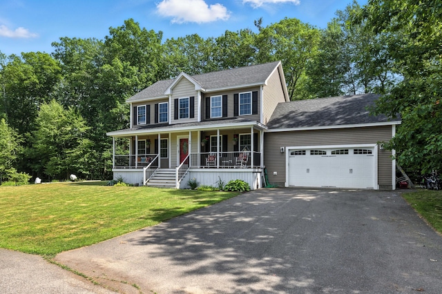 50 Carlisle Ln, Wells, ME 04090 - colonial house featuring covered porch, driveway, an attached garage, a front lawn, and a shingled roof