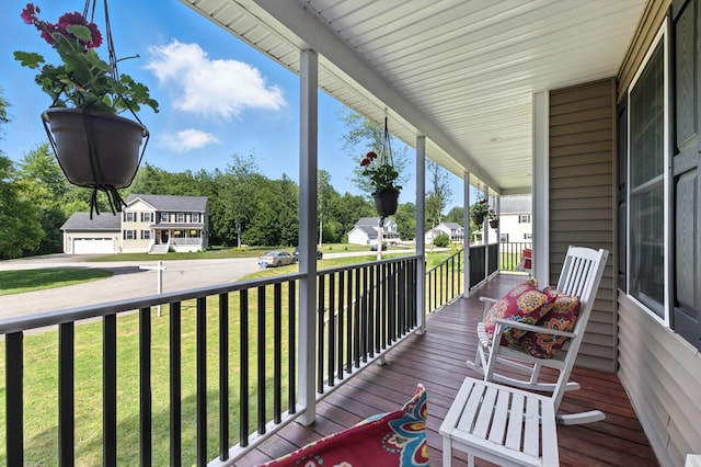 50 Carlisle Ln, Wells, ME 04090 - wooden porch featuring a yard and a residential view