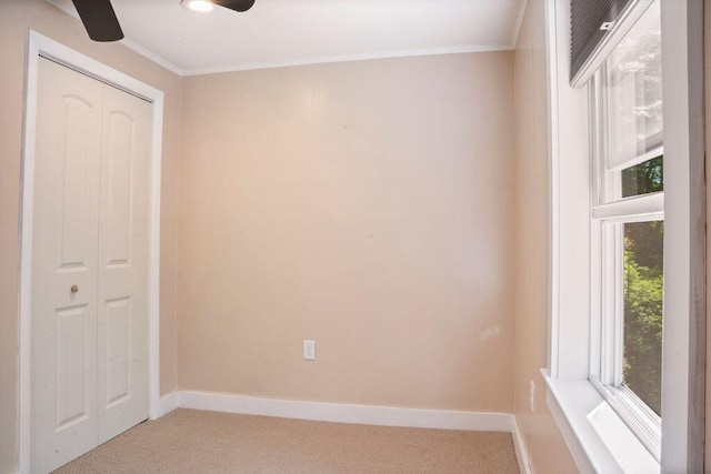 42 Winn Rd, Falmouth, ME 04105 - unfurnished bedroom featuring light colored carpet, a closet, crown molding, and ceiling fan