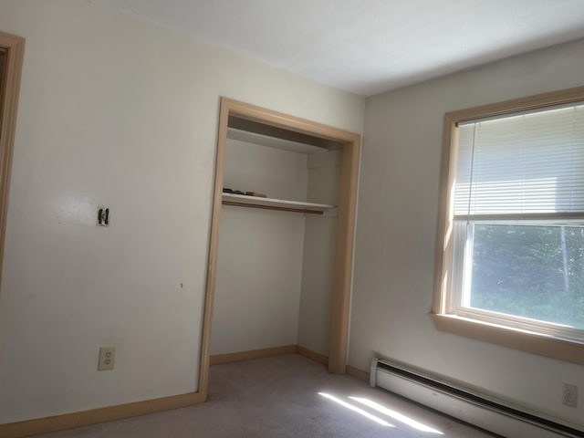 29 Range Rd, Brunswick, ME 04011 - unfurnished bedroom with a baseboard radiator, carpet, and a closet