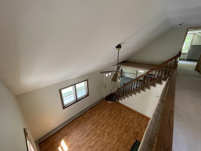 29 Range Rd, Brunswick, ME 04011 - unfurnished living room featuring vaulted ceiling, ceiling fan, wood finished floors, and a baseboard radiator