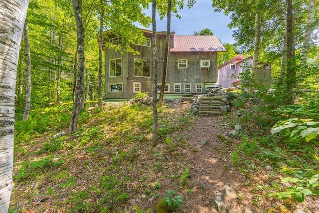 22 Woodpecker Ln, Embden, ME 04958 - back of house with a metal roof