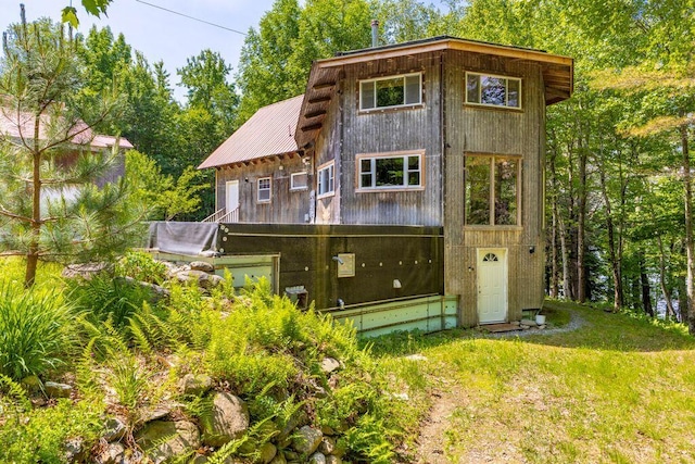 22 Woodpecker Ln, Embden, ME 04958 - rear view of house featuring a metal roof