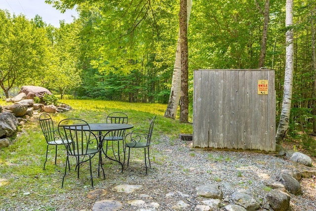 22 Woodpecker Ln, Embden, ME 04958 - view of yard featuring a wooded view