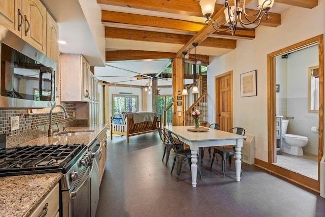 22 Woodpecker Ln, Embden, ME 04958 - kitchen featuring stainless steel appliances, beamed ceiling, a chandelier, light stone countertops, and light brown cabinets