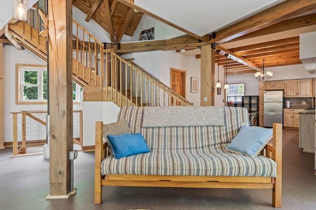 22 Woodpecker Ln, Embden, ME 04958 - living area with a chandelier and stairs