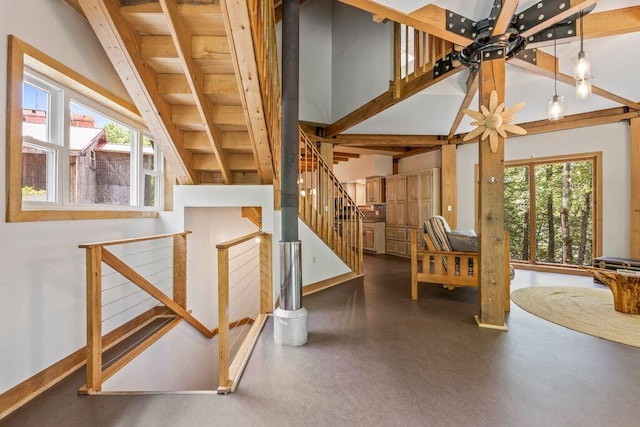 22 Woodpecker Ln, Embden, ME 04958 - stairs featuring plenty of natural light, wood ceiling, and ceiling fan