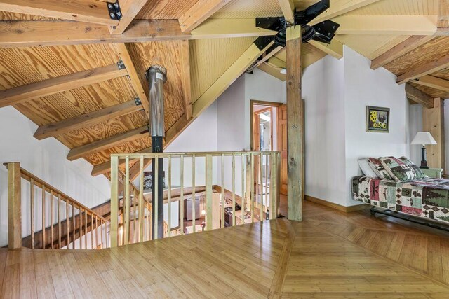 22 Woodpecker Ln, Embden, ME 04958 - sitting room with an upstairs landing, a ceiling fan, and beam ceiling