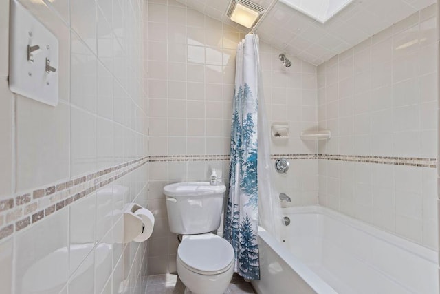 22 Woodpecker Ln, Embden, ME 04958 - full bathroom featuring tile walls and shower / bath combo with shower curtain
