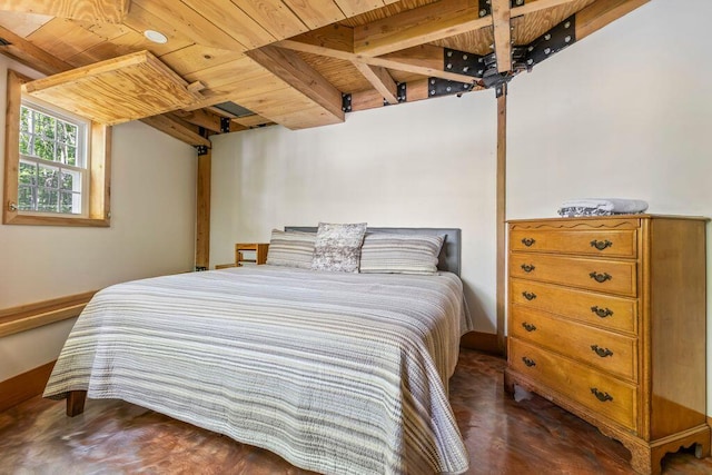 22 Woodpecker Ln, Embden, ME 04958 - bedroom with a wooden ceiling with exposed beams and baseboards
