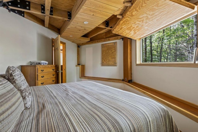 22 Woodpecker Ln, Embden, ME 04958 - bedroom with a wooden ceiling with exposed beams