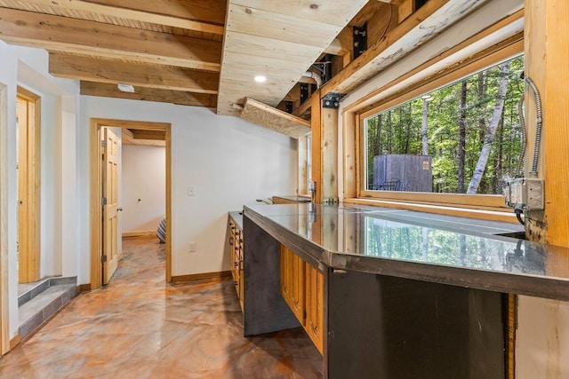 22 Woodpecker Ln, Embden, ME 04958 - kitchen featuring concrete floors and wooden ceiling