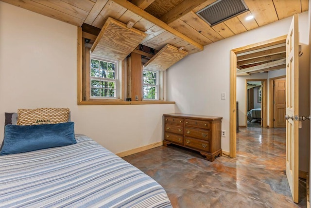 22 Woodpecker Ln, Embden, ME 04958 - bedroom with finished concrete flooring and a wooden ceiling with exposed beams