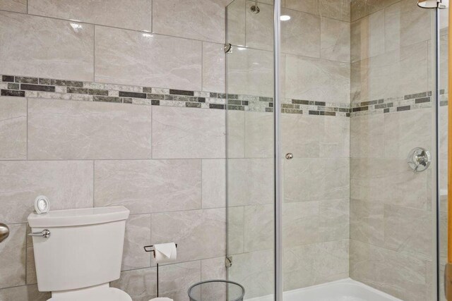 22 Woodpecker Ln, Embden, ME 04958 - full bathroom with a tile shower and toilet