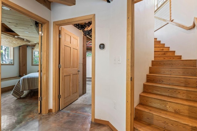 22 Woodpecker Ln, Embden, ME 04958 - staircase featuring concrete flooring and baseboards