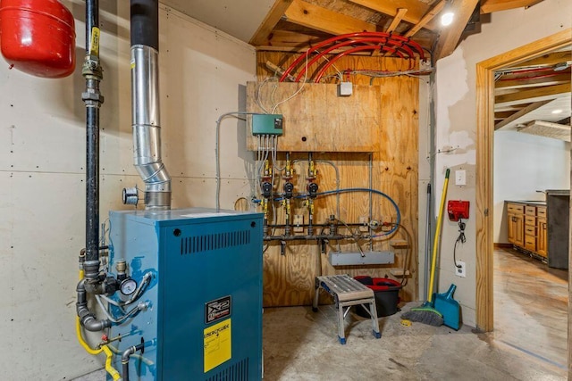 22 Woodpecker Ln, Embden, ME 04958 - utilities with a heating unit and a sink