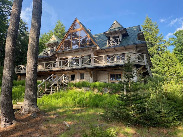 378 Black Point Rd, Beaver Cove, ME 04441 - back of house with a wooden deck and stairway