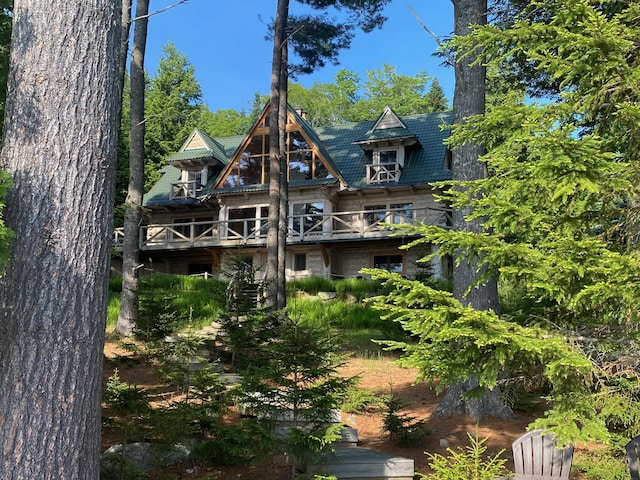 378 Black Point Rd, Beaver Cove, ME 04441 - rear view of property featuring a balcony