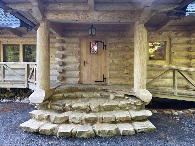 378 Black Point Rd, Beaver Cove, ME 04441 - doorway to property featuring log siding