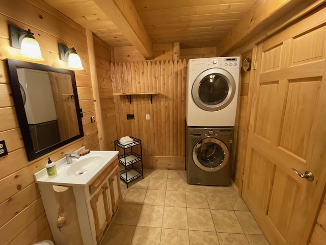 378 Black Point Rd, Beaver Cove, ME 04441 - bathroom featuring stacked washer / dryer, wooden walls, a wood ceiling with exposed beams, tile patterned flooring, and vanity