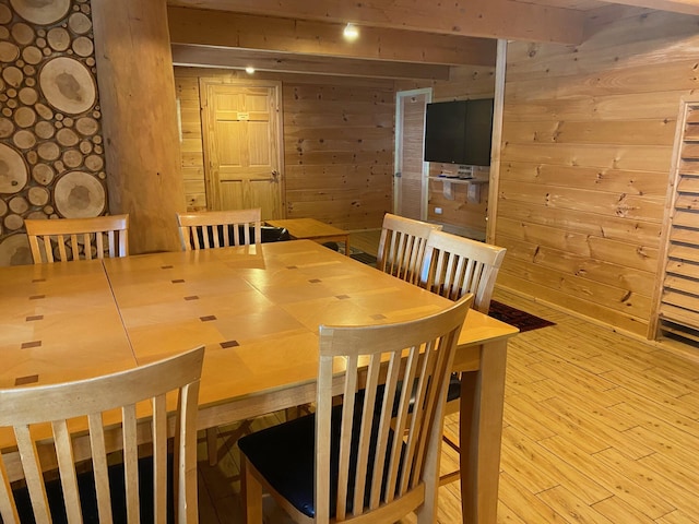 378 Black Point Rd, Beaver Cove, ME 04441 - dining room featuring wooden walls and wood finished floors