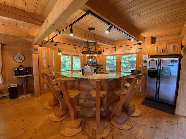 378 Black Point Rd, Beaver Cove, ME 04441 - kitchen with rail lighting, fridge with ice dispenser, a wooden ceiling with exposed beams, stainless steel microwave, and light wood-type flooring
