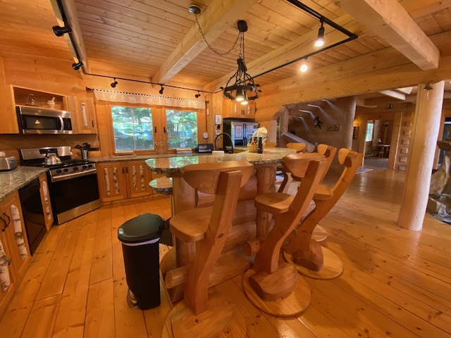 378 Black Point Rd, Beaver Cove, ME 04441 - dining space with rail lighting, a wooden ceiling with exposed beams, light wood-style floors, and french doors